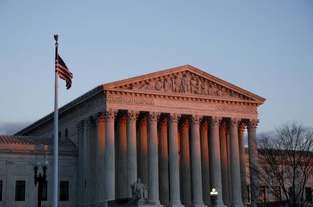 The United States Supreme Court is seen at sunset in Washington December 10, 2014. REUTERS/Gary Cameron