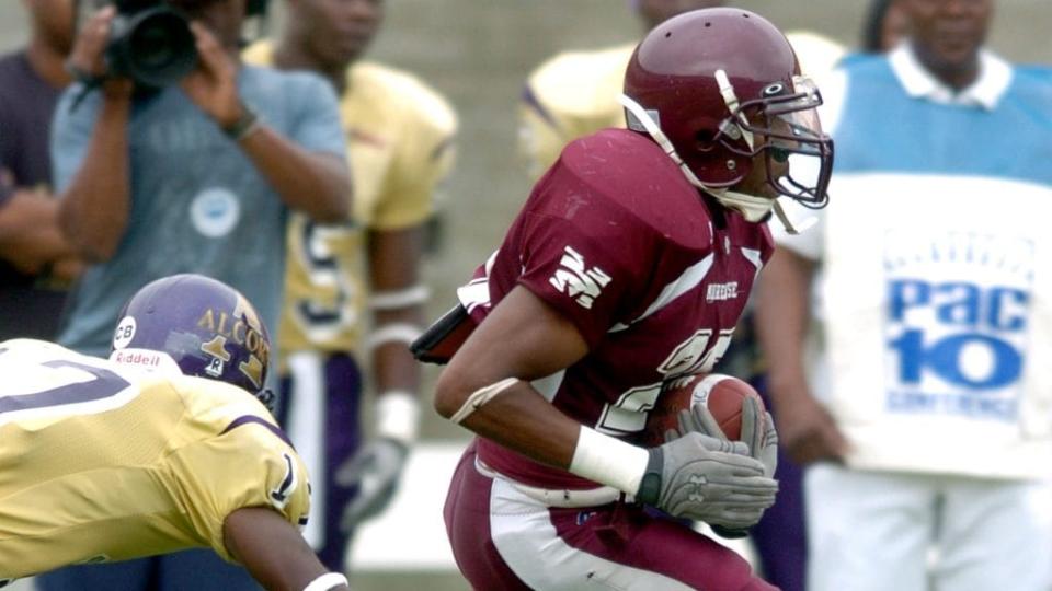 Defensive back Robert Harris of the Morehouse College Maroon Tigers runs back in an interception a 23 to 6 loss to the Alcorn State University Braves on September 30, 2006 at the Los Angeles Memorial Colesium in Los Angeles, California. (Photo by Reuben Canales/Getty Images)