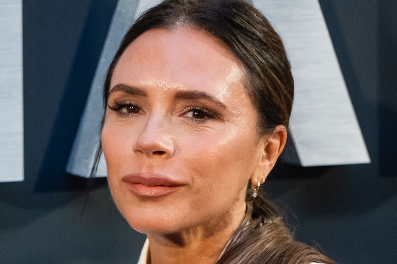 Victoria Beckham in a white suit on the red carpet