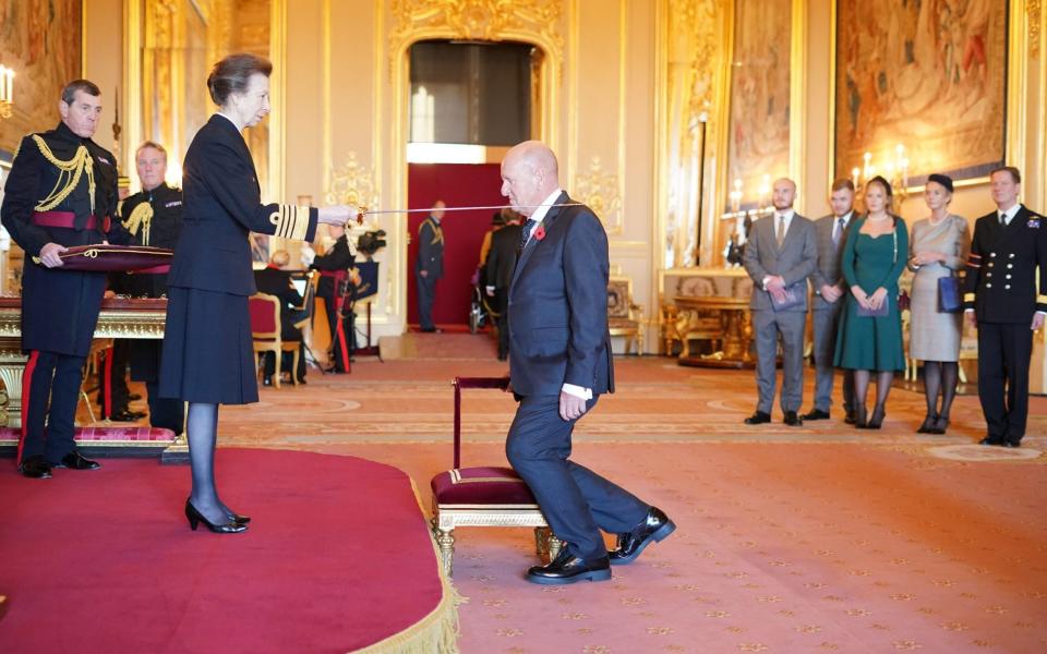 Ian Livingstone receiving his knighthood from the Princess Royal at Windsor Castle - Jonathan Brady/PA