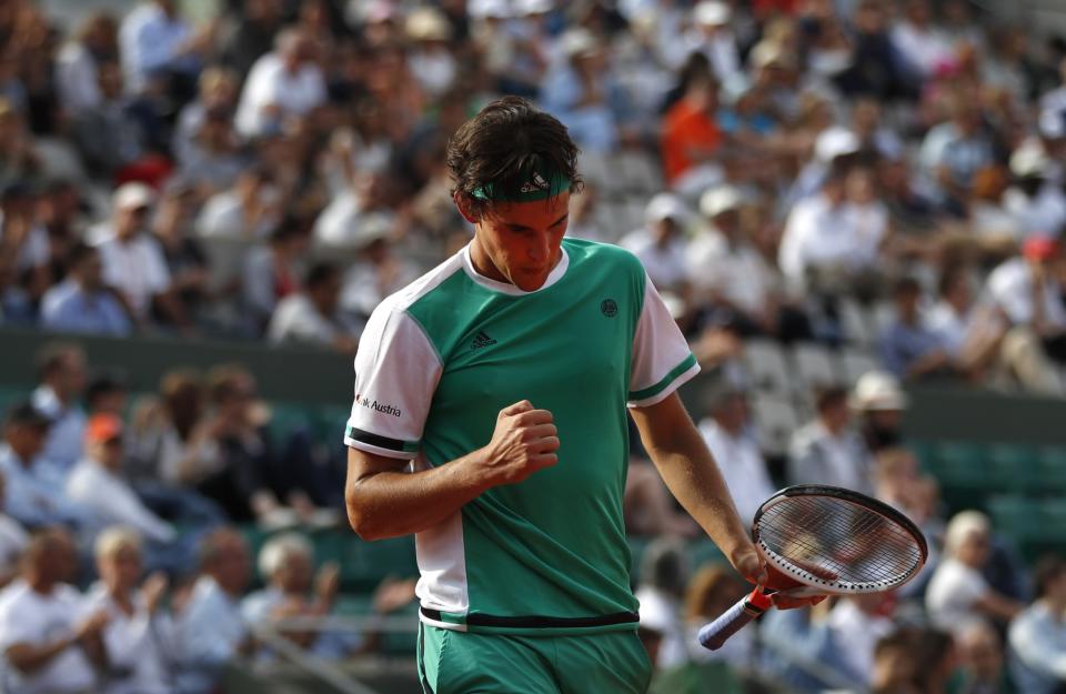 Austria's Dominic Thiem clenches his fist after winning a point as he plays Argentina's Horacio Zeballos during their fourth round match of the French Open tennis tournament at the Roland Garros stadium