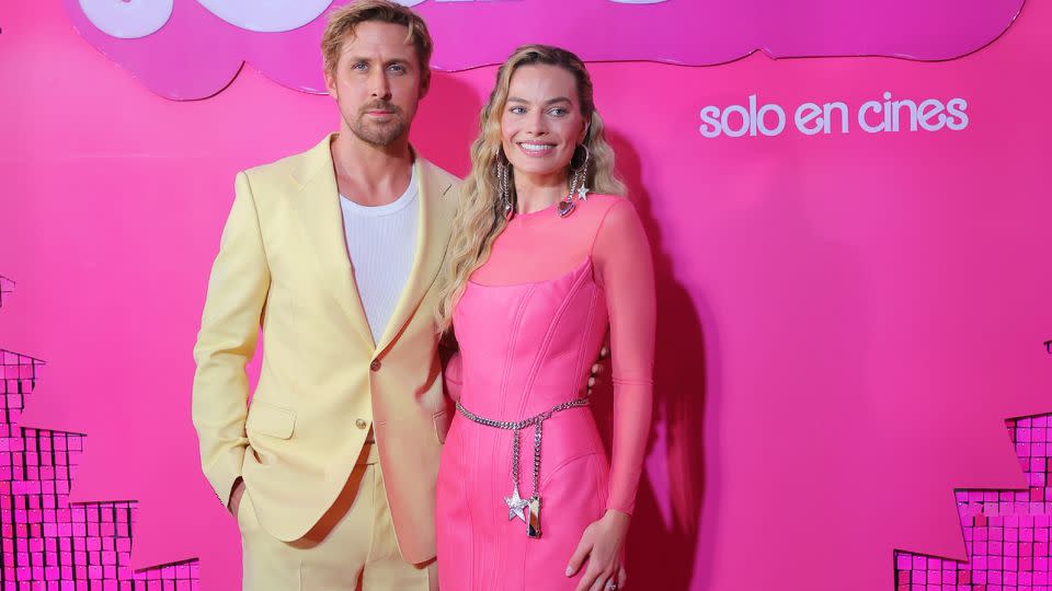 Gosling and Robbie, wearing Balmain, posed during a pink carpet press event on July 6 in Naucalpan de Juarez, Mexico. Robbie's look is inspired by the 1992 "Earring Magic" Barbie, and matches the doll's sculpted bodice, chunky belt and earrings perfectly. (She is, however, missing the highly-teased high ponytail.) - Hector Vivas/Getty Images
