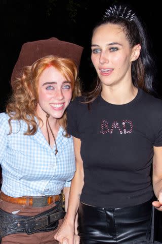 <p>ALEXJR / BACKGRID</p> Billie Eilish, who dressed as a Cowgirl and Devon Lee Carlson at Kendall Jenner's Halloween Party at Chateau Marmont in Los Angeles.