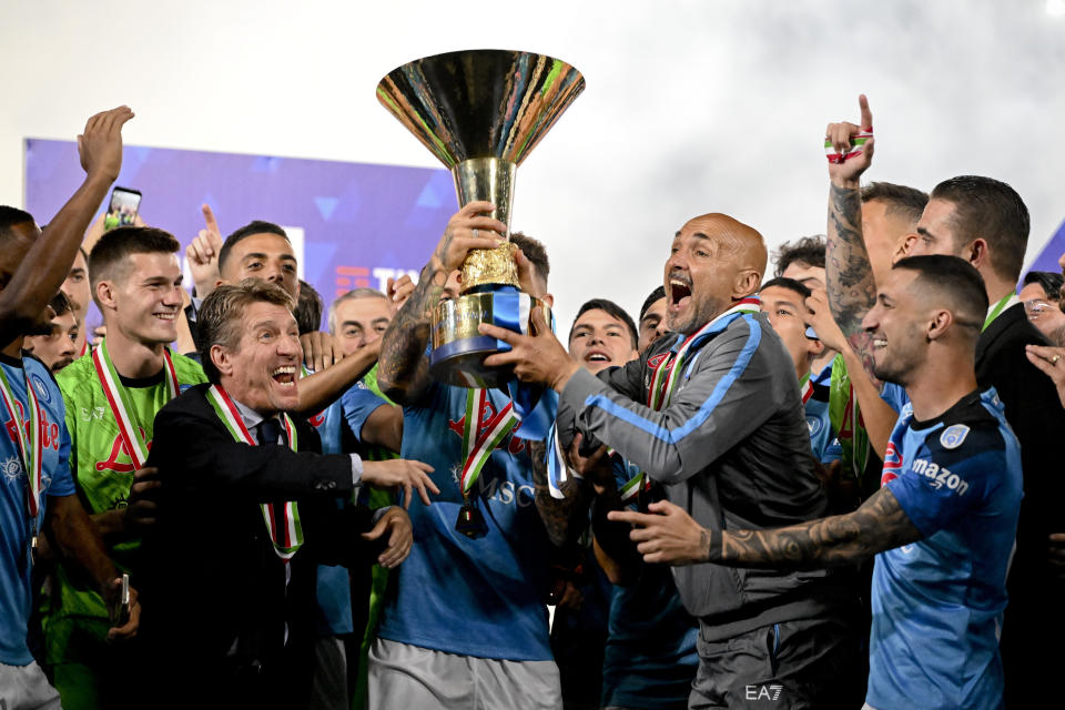Napoli's coach Luciano Spalletti, second from right celebrates with his players after winning the Serie A soccer title trophy at the Diego Maradona Stadium, in Naples, Sunday, June 4, 2023.(Ciro Fusco/ANSA, Pool Photo via AP)