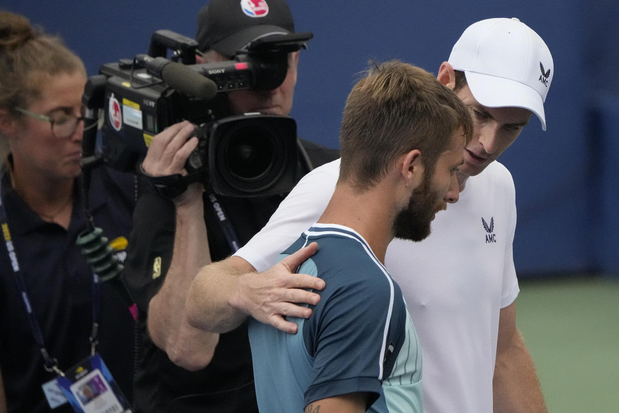 Andy Murray, of Great Britain, talks with Corentin, Moutet, of France, after defeating Moutet in the first round of the U.S. Open tennis championships, Tuesday, Aug. 29, 2023, in New York. (AP Photo/Mary Altaffer)