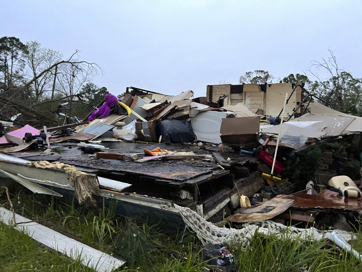 Damage is seen at a house on South Main Street in Pembroke, Ga., 30 miles from Savannah, after a storm passed through the city, Tuesday, April 5, 2022. (AP Photo/Lewis Levine)