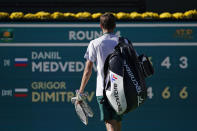 Daniil Medvedev, of Russia, walks off the court after losing to Grigor Dimitrov, of Bulgaria, at the BNP Paribas Open tennis tournament Wednesday, Oct. 13, 2021, in Indian Wells, Calif. (AP Photo/Mark J. Terrill)