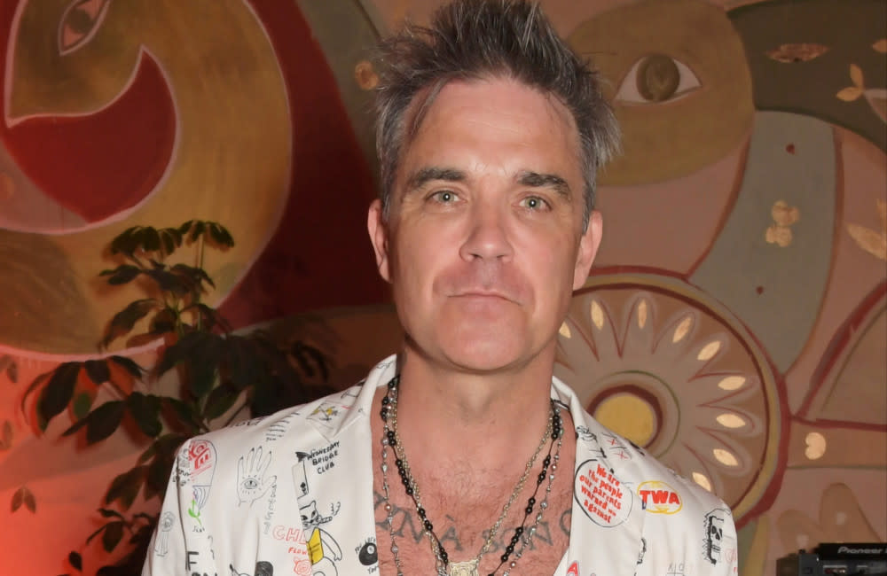 Robbie Williams credits 'white witch' mother for UFO obsession credit:Bang Showbiz