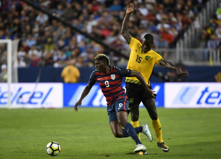 USA's Gyasi Zardes (L) fights for the ball with Je-Vaughn Watson of Jamaica during the 2017 CONCACAF Gold Cup final match, at the Levi's Stadium in Santa Clara, California, on July 26