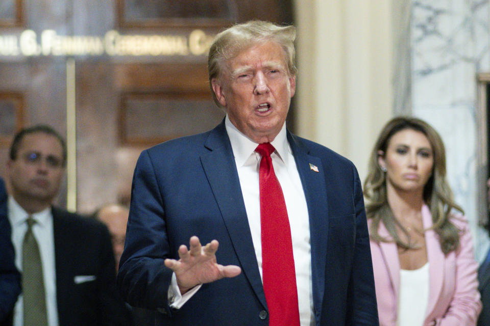 FILE - Former President Donald Trump speaks after exiting the courtroom for a break at New York Supreme Court, Dec. 7, 2023, in New York. Trump has secured a bond sufficient to support an $83.3 million jury award granted to writer E. Jean Carroll during a January defamation trial stemming from rape claims she made against Trump, his lawyer said Friday, March 8, 2024, as she notified the federal judge who oversaw the trial that an appeal was underway.(AP Photo/Eduardo Munoz Alvarez, File)