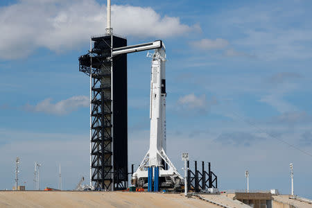 A SpaceX Falcon 9 carrying the Crew Dragon spacecraft sits on launch pad 39A prior to the uncrewed test flight to the International Space Station from the Kennedy Space Center in Cape Canaveral, Florida, U.S., March 1, 2019. REUTERS/Mike Blake