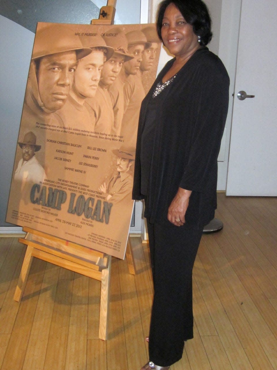 Playwright Celeste Bedford Walker stands in the lobby of the Robey Theatre in Los Angeles during the production of her military drama "Camp Logan."