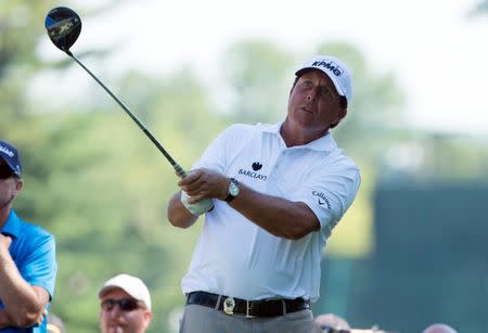 Jul 26, 2016; Springfield, NJ, USA; Phil Mickelson hits off the on the sixth tee during a practice round for the 2016 PGA Championship golf tournament at Baltusrol GC - Lower Course. Bill Streicher-USA TODAY Sports