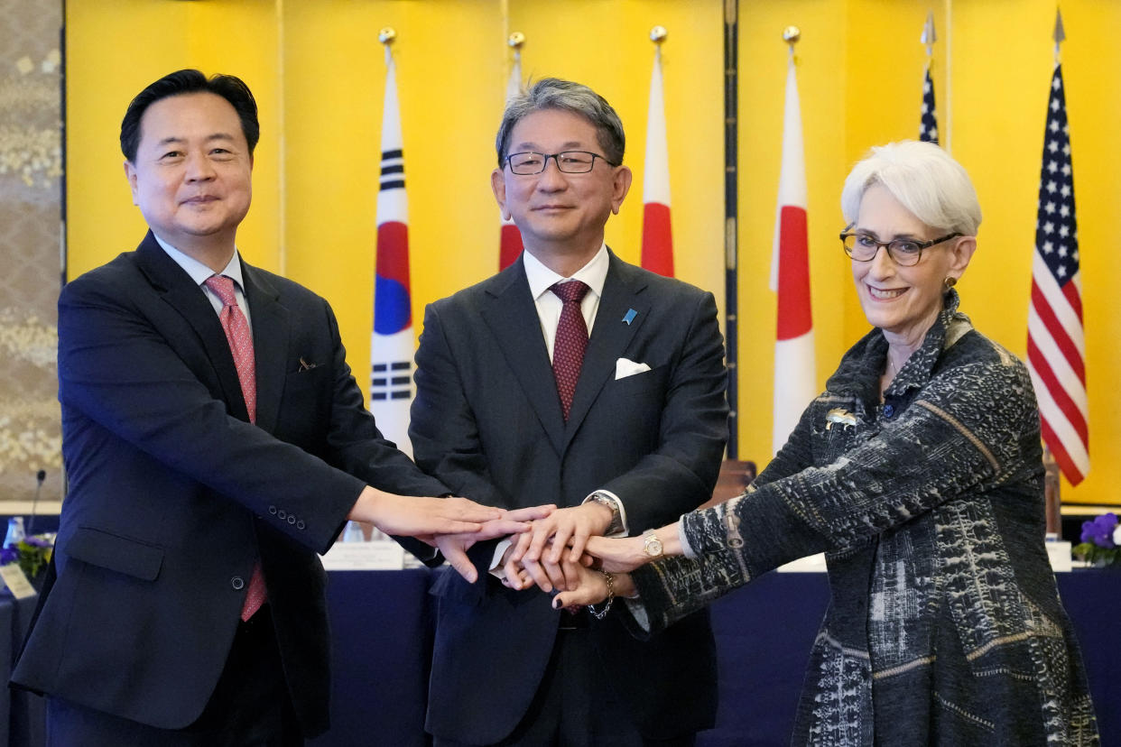 Japanese Vice Foreign Minister Takeo Mori, center, U.S. Deputy Secretary of State Wendy Sherman, right, and South Korean First Vice Foreign Minister Cho Hyungdong, left, pose for photographers prior to their trilateral meeting Wednesday, Oct. 26, 2022, at the Iikura guesthouse in Tokyo. (AP Photo/Eugene Hoshiko, Pool)