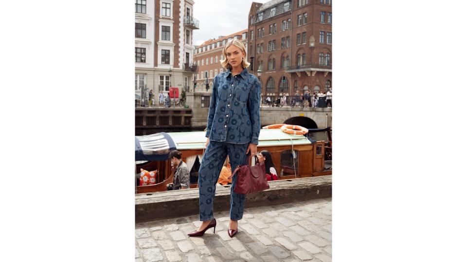 Emilia Silberg wears matchy-matchy blue denim with oxblood accessories.