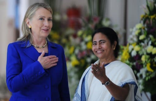 US Secretary of State Hillary Clinton talks with West Bengal's chief minister Mamata Banerjee at the Writers' Building in Kolkata. Clinton has urged India to further cut its imports of Iranian oil, saying that the Islamic republic posed a major threat if it developed nuclear weapons