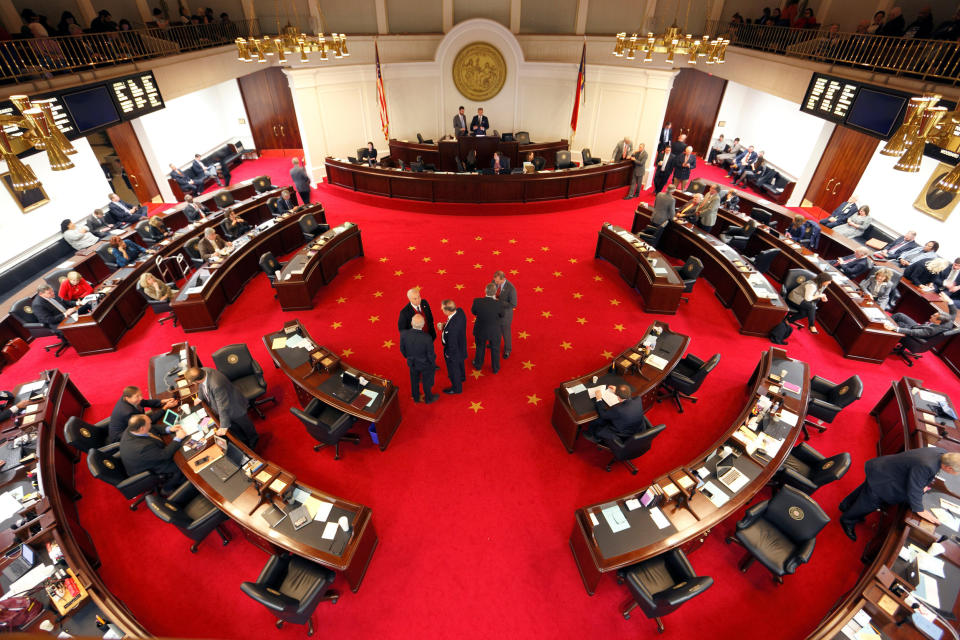 Image: Lawmakers confer during a negotiations on the floor of North Carolina's State Senate chamber as they meet to consider repealing the controversial HB2 law limiting bathroom access for transgender people in Raleigh, North Carolina (JONATHAN DRAKE / Reuters)