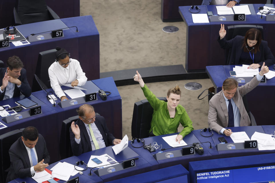 Lawmakers vote on the Artificial Intelligence act Wednesday, June 14, 2023 at the European Parliament in Strasbourg, eastern France. Authorities worldwide are racing to rein in artificial intelligence, including in the European Union, where groundbreaking legislation is set to pass a key hurdle Wednesday. European Parliament lawmakers are due to vote on the proposal — including controversial amendments on facial recognition. (AP Photo/Jean-Francois Badias)