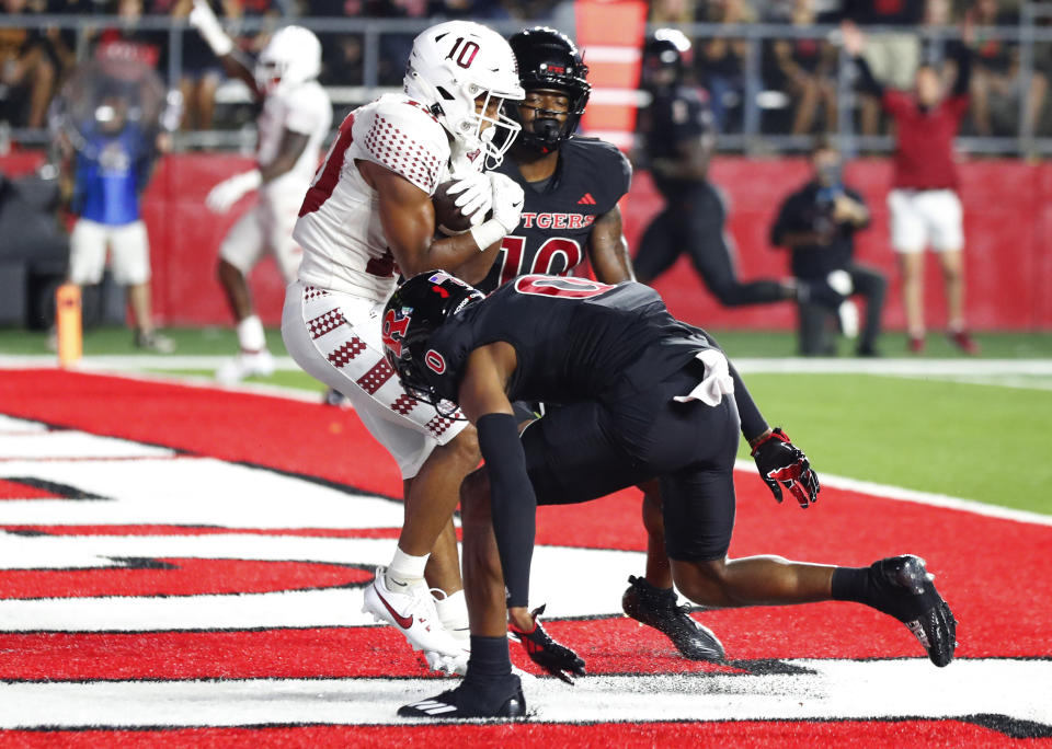 Temple wide receiver Dante Wright (10) makes a catch for a touchdown against Rutgers defensive backs Flip Dixon (10) and Eric Rogers (0) during the second half of an NCAA college football game Saturday, Sept. 9, 2023, in Piscataway, N.J. (AP Photo/Noah K. Murray)