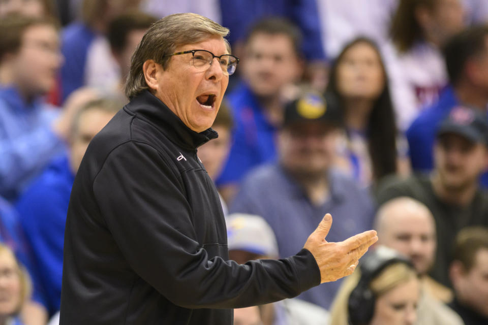 Texas Tech head coach Mark Adams calls instructions to his team against Kansas during the first half of an NCAA college basketball game in Lawrence, Kan., Tuesday, Feb. 28, 2023. (AP Photo/Reed Hoffmann)