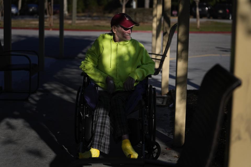 Tony McGuire looks to the parking lot of the community center where he resides on Wednesday, Dec. 6, 2023, in Prichard, Ala. McGuire and his wife lost their home and two dogs to a fire in the city’s Alabama Village neighborhood, where water leaks often cause low water pressure that makes firefighting difficult. (AP Photo/Brynn Anderson)