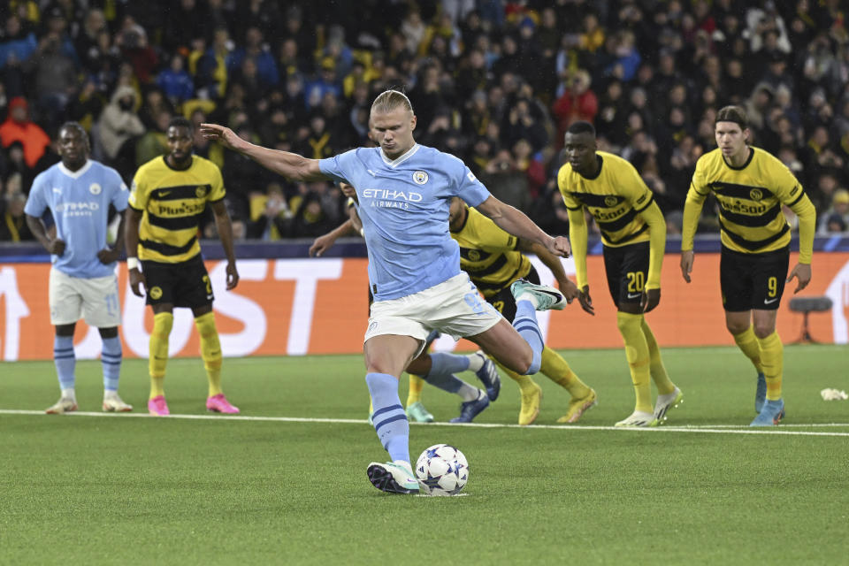 Manchester City's Erling Haaland shoots a penalty shot to score, during the Champions League group G soccer match between BSC Young Boys and Manchester City, at the Wankdorf stadium, in Bern, Switzerland, Wednesday, Oct. 25, 2023. (Anthony Anex/Keystone via AP)