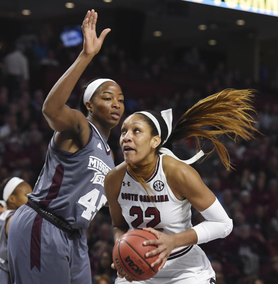 FILE - In this Sunday, March 5, 2017, file photo, South Carolina forward A'ja Wilson (22) drives against Mississippi State center Chinwe Okorie (45) in the first half of an NCAA college basketball game during the Southeastern Conference tournament in Greenville, S.C. South Carolina is traveling West for the NCAA Tournament again. The Gamecocks earned their fourth straight No. 1 seed, heading up the Stockton, California, regional in the brackets announced Monday, March 13. (AP Photo/Rainier Ehrhardt, File)