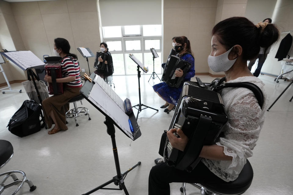 Defector Yu Hwa-suk, right, plays the accordion during the accordion class at the Inter-Korean Cultural Integration Center in Seoul, South Korea, on June 10, 2021. The center, which opened last year, is South Korea’s first government-run facility to bring together North Korean defectors and local residents to get to know each other through cultural activities and fun. It’s meant to support defectors’ often difficult resettlement in the South, but also aims at studying the possible blending of the rivals’ cultures should they unify. (AP Photo/Ahn Young-joon)