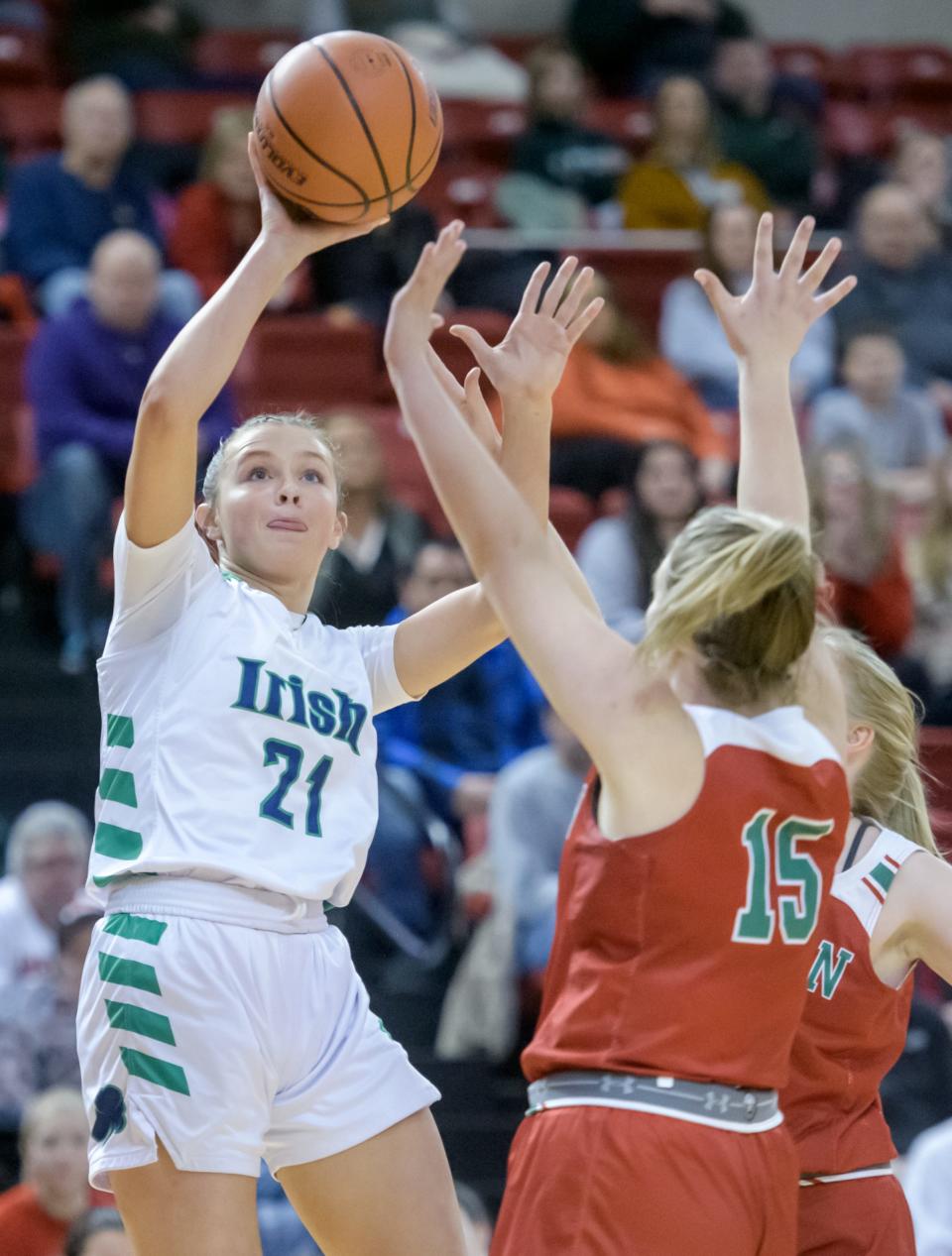 Peoria Notre Dame's Kaitlin Cassidy puts up a shot over Lincoln's Piper Whiteman in the first half of their nonconference basketball game Saturday, Jan. 20, 2024 at Renaissance Coliseum in Peoria. The Irish fell to the Railsplitters 63-52.