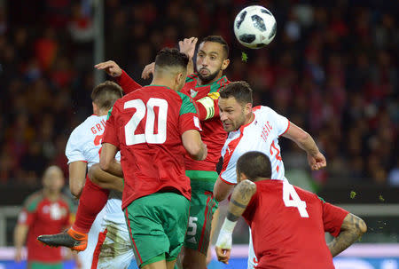 Soccer Football - International Friendly - Serbia vs Morocco - Stadio Olimpico Grande Torino, Turin, Italy - March 23, 2018 Serbia's Dusko Tosic in action with Morocco's Medhi Benatia and Aziz Bouhaddouz REUTERS/Massimo Pinca