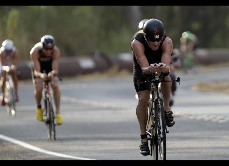 Lance Armstrong competes in the Ironman Panama 70.3. triathlon in Panama City, Sunday Feb. 12, 2012. The race consists of a 1.2-mile swim, a 56-mile bike ride and a 13.1-mile run. 