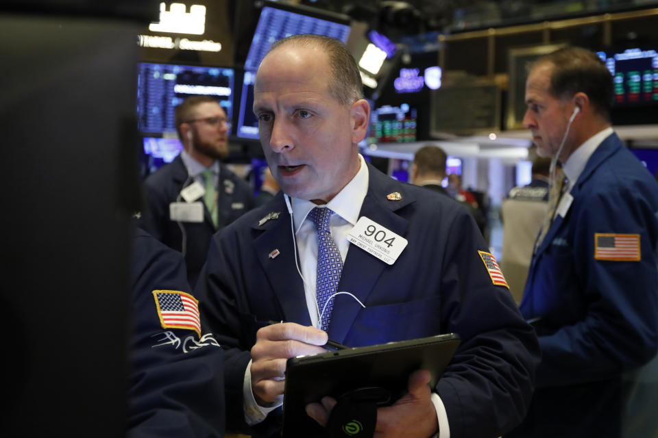 Trader Michael Urkonis works on the floor of the New York Stock Exchange, Tuesday, Nov. 12, 2019. Stocks are opening slightly higher on Wall Street, led by gains in technology and health care companies. (AP Photo/Richard Drew)