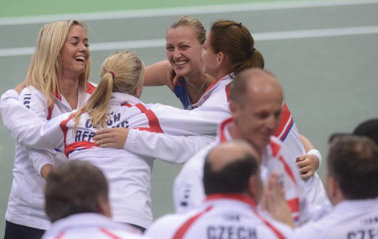 Czech Republic's (from L) Klara Koukalova, Andrea Hlavackova, Petra Kvitova and Lucie Safarova celebrate after Kvitova defeated Italy's Roberta Vinci in their Fed Cup World Group semi-final match, in Ostrava, on April 20, 2014