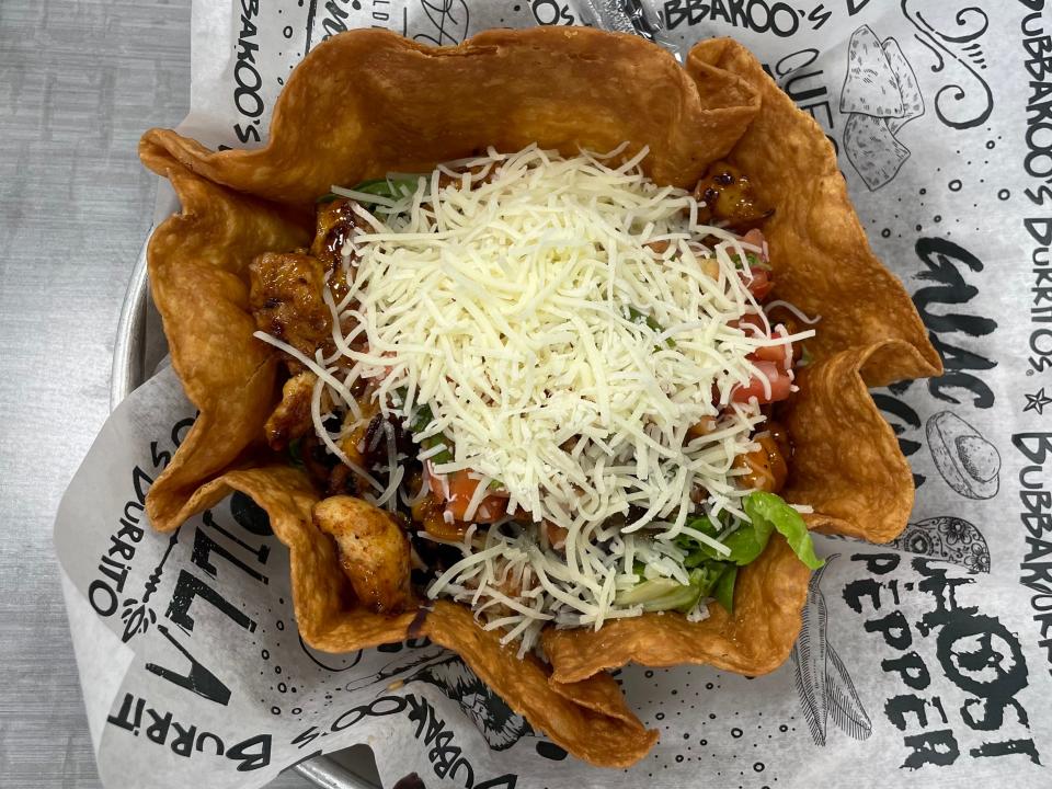 The mango habanero grilled chicken tostada salad is a unique take on the traditional burrito bowl.