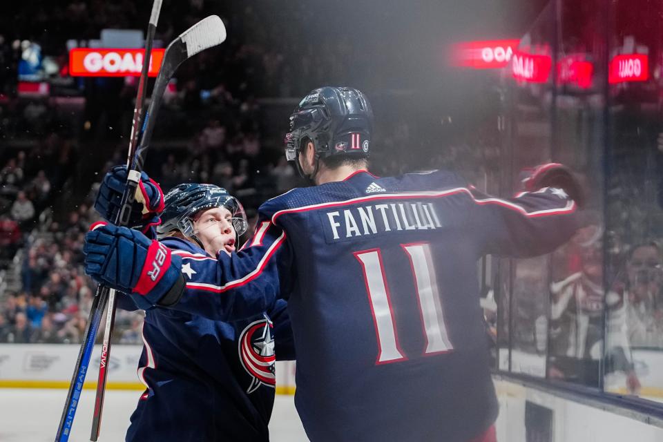 Dec 8, 2023; Columbus, Ohio, USA; Columbus Blue Jackets center Adam Fantilli (11) celebrates scoring a goal with center Kent Johnson (91) during the first period of the NHL game against the St. Louis Blues at Nationwide Arena.