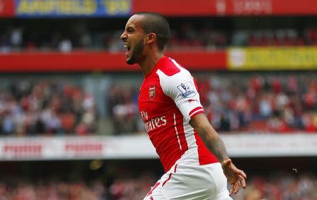 Theo Walcott celebrates after scoring the second goal for Arsenal. Reuters / Eddie Keogh