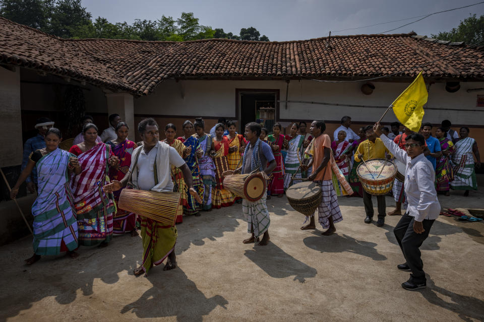 Tribespeople perform an indigenous folk dance in village Guduta, in the eastern Indian state of Odisha, Oct. 20, 2022. India's 110 million indigenous tribespeople scattered across various states and fragmented into hundreds of clans, with different legends, different languages and different words for their gods adhere to Sarna Dharma - a faith not officially recognized by the government. It is a belief system that shares common threads with the world's many ancient nature-worshipping religions. (AP Photo/Altaf Qadri)