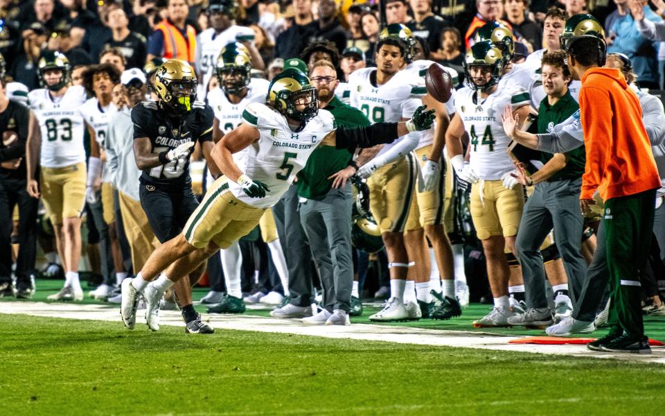 CSU football's Dallin Holker (5) dives for a catch that's just out of reach late in the game against CU in the Rocky Mountain Showdown on Sept. 16, 2023 at Folsom Field in Boulder, Colo.