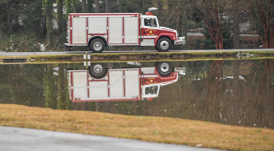 A fire truck rides around the pond on Northhampton Road in Anderson, Thursday, January 20 2022.