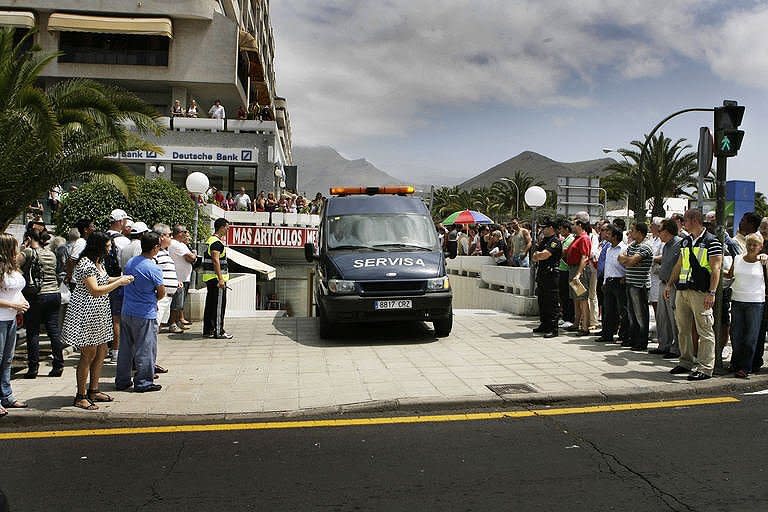 A van carries the remains of a British woman who was attacked and decapitated in a supermarket in Los Cristianos, on the Spanish resort island of Tenerife. The deranged knifeman attacked the woman and fled with her head before being arrested, police said