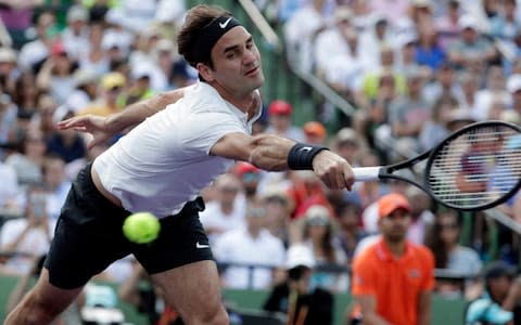 Roger Federer, of Switzerland, goes to the net against Thanasi Kokkinakis, of Australia, during the Miami Open tennis tournament, Saturday, March 24, 2018, in Key Biscayne, Fla - Credit: AP