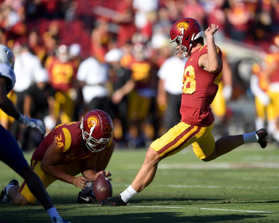 Sep 4, 2021; Los Angeles, California, USA;  USC Trojans place kicker Parker Lewis (48) hits an extra point in the second half of the game against the San Jose State Spartans at United Airlines Field at Los Angeles Memorial Coliseum. Mandatory Credit: Jayne Kamin-Oncea-USA TODAY Sports