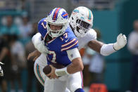 Miami Dolphins defensive end Emmanuel Ogbah (91) grabs Buffalo Bills quarterback Josh Allen (17) during the first half of an NFL football game, Sunday, Sept. 25, 2022, in Miami Gardens, Fla. (AP Photo/Rebecca Blackwell)