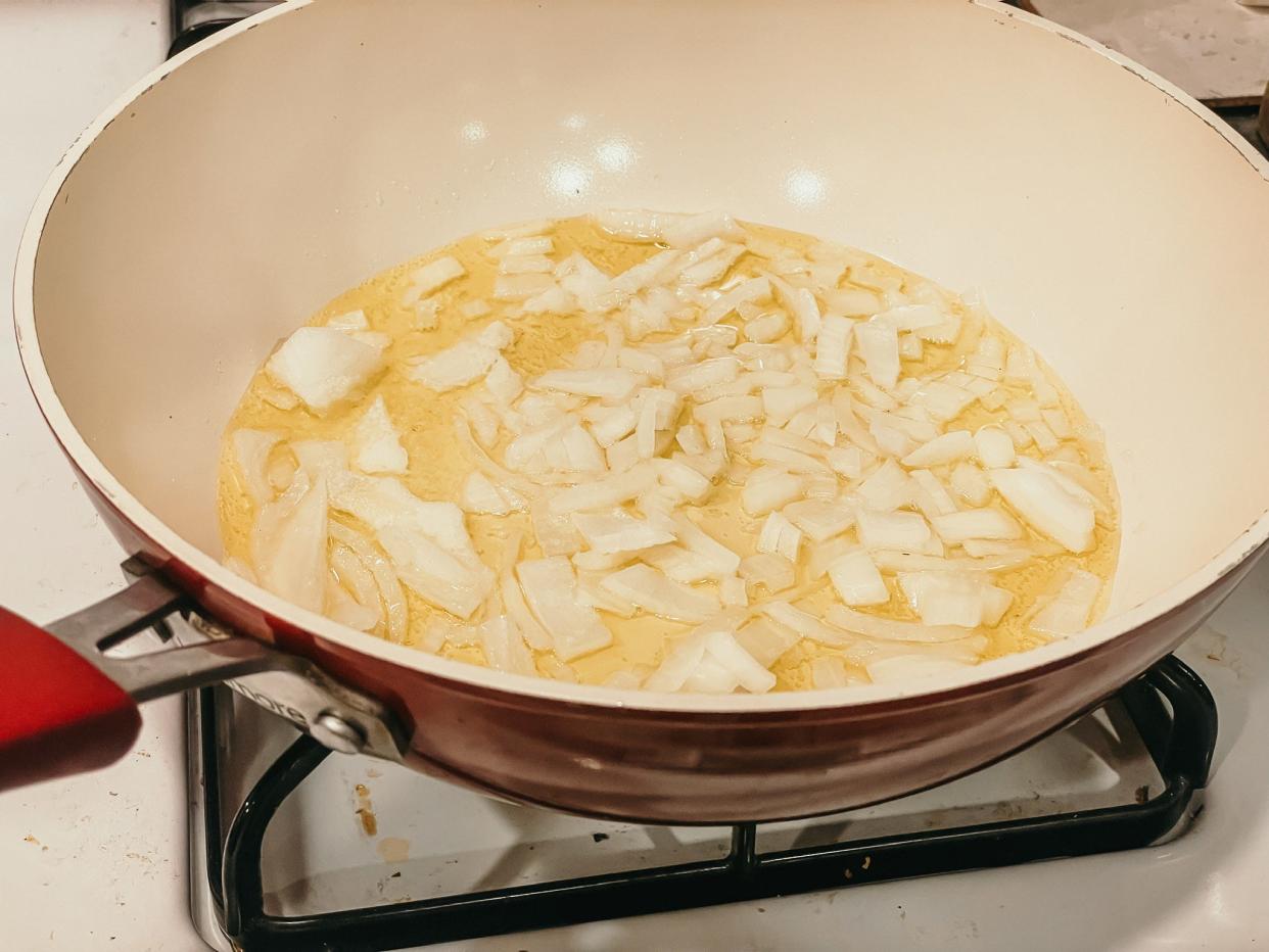 chopped onion in a pan with oil