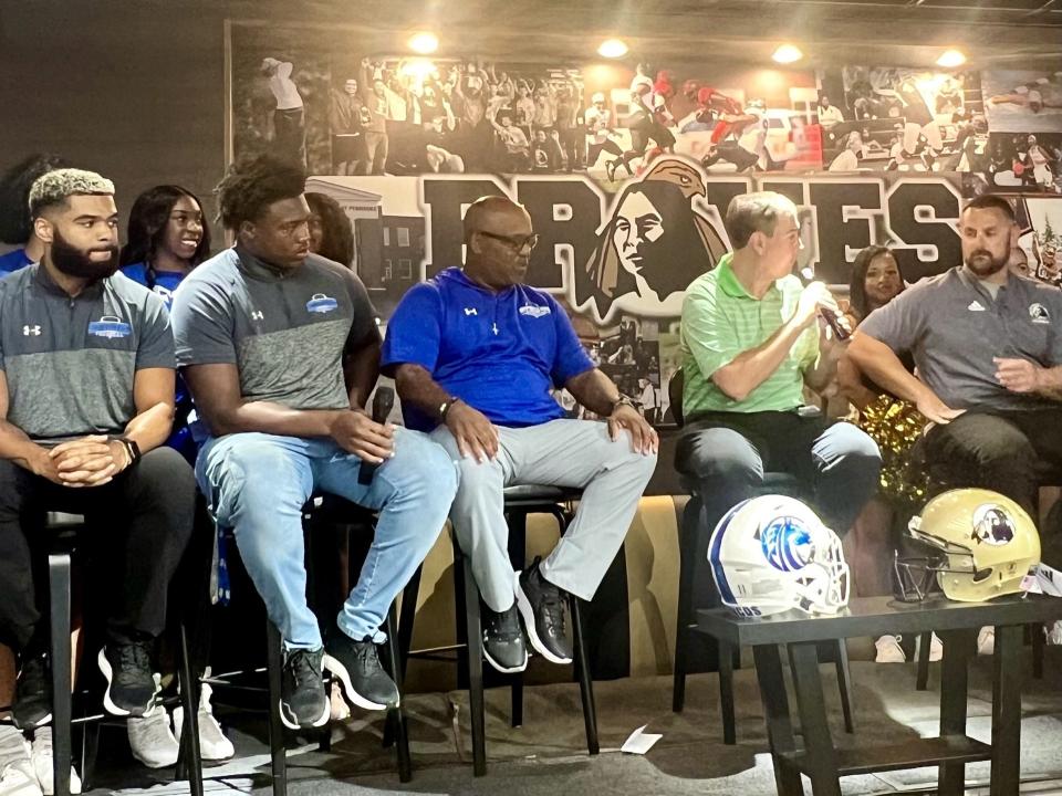 From left, Fayetteville State football senior defensive back Dylan Morris, junior tackle Mike Todd, coach Richard Hayes, moderator Jonathan Bym and UNCP coach Mark Hall meet up to discuss the Two Rivers Classic at a kickoff show in Pembroke on Monday, Aug. 28, 2023.