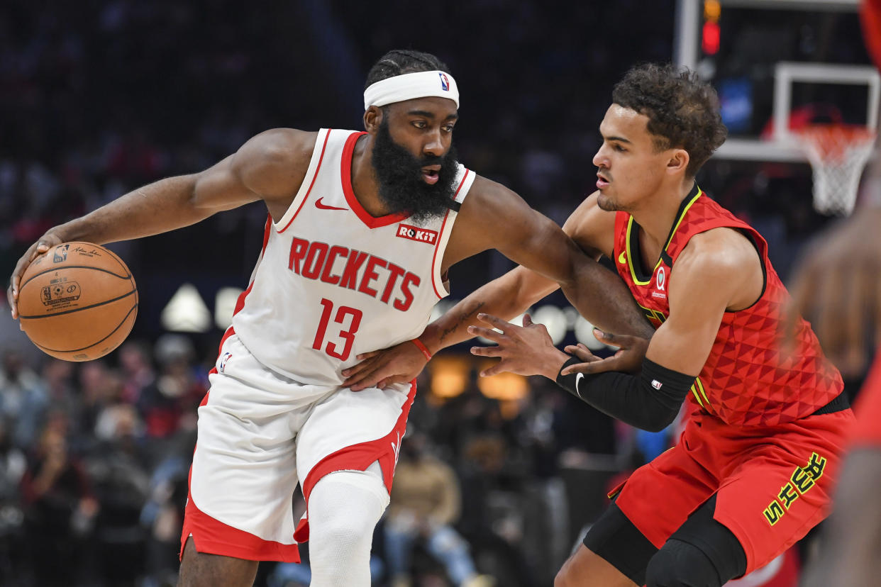 Jan 8, 2020; Atlanta, Georgia, USA; Houston Rockets guard James Harden (13) is defended by Atlanta Hawks guard Trae Young (11) during the first half at State Farm Arena. Mandatory Credit: Dale Zanine-USA TODAY Sports