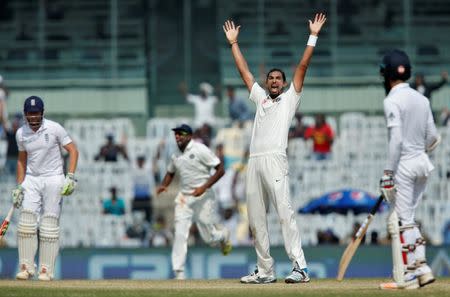 Cricket - India v England - Fifth Test cricket match - M A Chidambaram Stadium, Chennai, India - 20/12/16. India's Ishant Sharma celebrates the dismissal of England's Jonny Bairstow (L). REUTERS/Danish Siddiqui