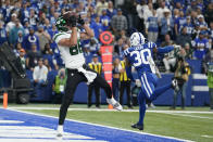 New York Jets' Keelan Cole (88) makes a touchdown reception against Indianapolis Colts' George Odum (30) during the second half of an NFL football game, Thursday, Nov. 4, 2021, in Indianapolis. (AP Photo/Michael Conroy)