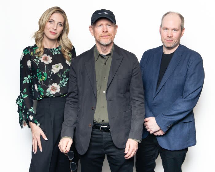 Century City, CA - November 15: Director Ron Howard, center, and members of the sound team for his film "Thirteen Lives," Rachel Tate, left, and Oliver Tarney, right, sit for portraits in a storage room inside an AMC Theatre complex in Name of Location on Tuesday, Nov. 15, 2022 in Century City, CA. (Brian van der Brug / Los Angeles Times)