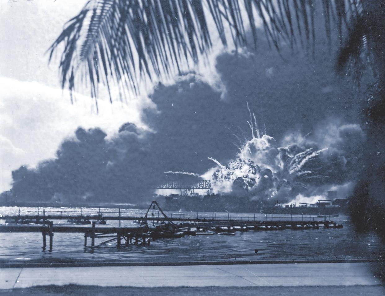 The destroyer USS Shaw explodes after being hit by bombs during the Japanese surprise attack on Pearl Harbor, Hawaii, on December 7, 1941. (AP Photo)